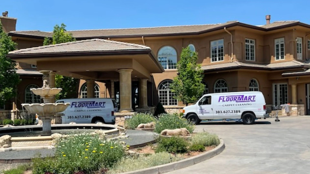 Floormart vans parked outside a home